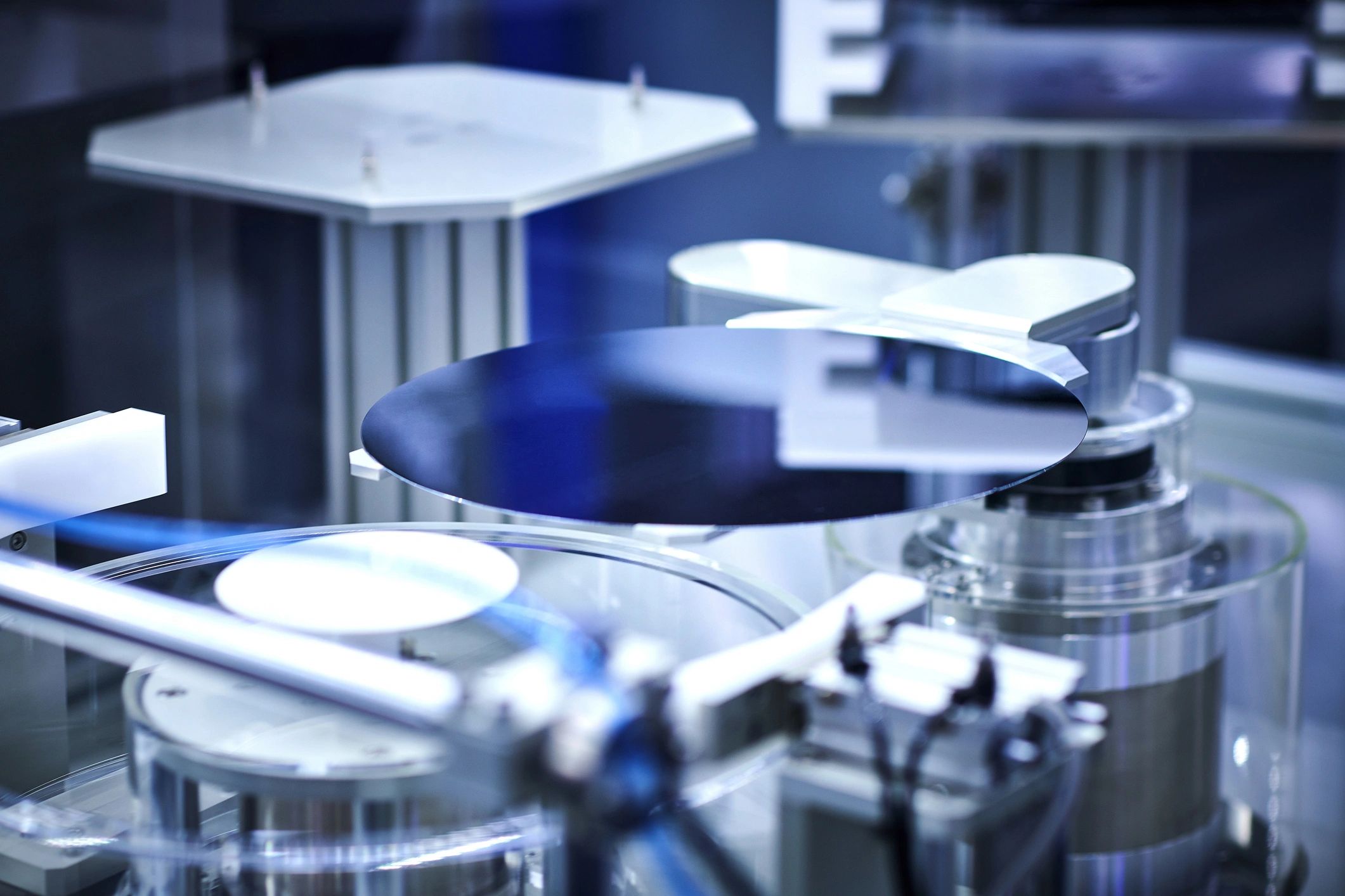 Silicon wafer on a robotic arm in a cleanroom
